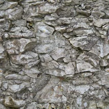 Texture of a stone wall. Background rock. Stock Photos