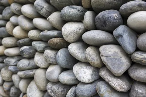 Texture of the stone wall for background . Stone wall of cobblestones backg.. Stock Photos