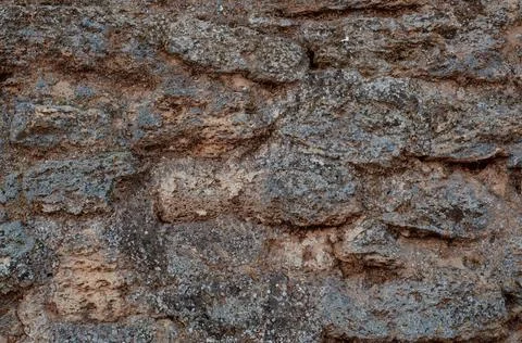 The texture of the stone wall. Background texture of the stone wall of the ol Stock Photos