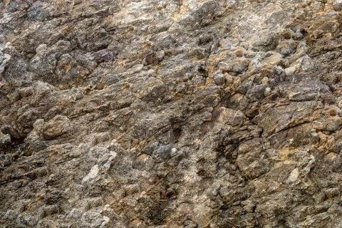 Texture stone wall canvas part of rock uneven weathered background beige brow Stock Photos