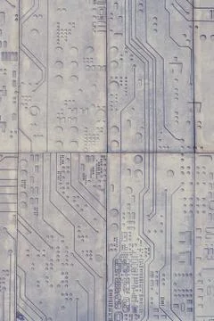 The texture of a stone wall with a carved pattern of a digital computer chip 스톡 사진