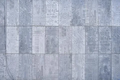 Texture of a stone wall with a carved pattern of a computer circuit board Stock Photos