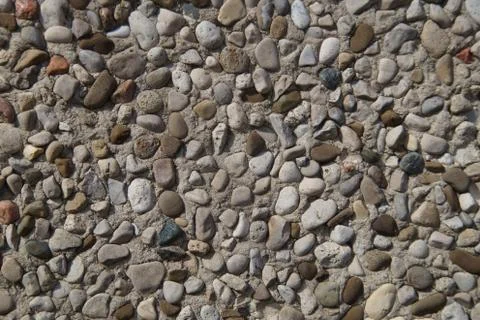 Texture of stone wall covered with pebbles 스톡 사진