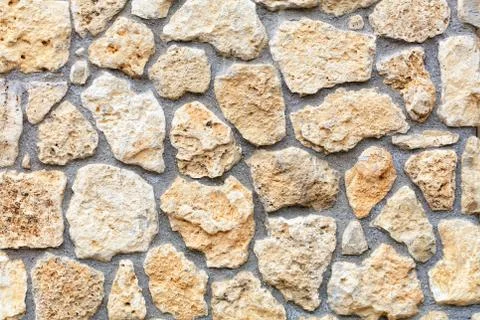 Texture of a stone wall extruded from a large cobblestone of a shell rock, cl Foto stock