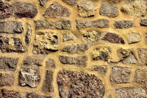 Texture of stone wall on gothic medieval cathedral. Stock Photos