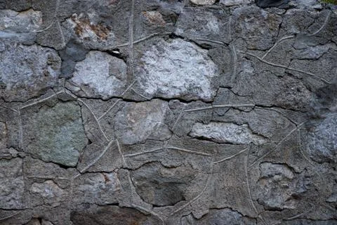 Texture of stone wall made of grey stones Stock Photos