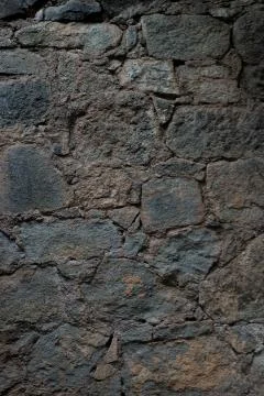 Texture of stone wall made of grey stones Stock Photos