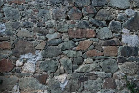 Texture of stone wall made of grey stones Stock Photos