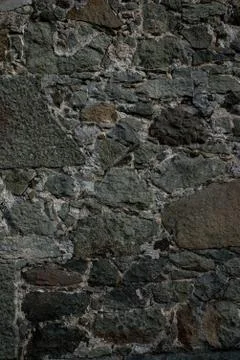 Texture of stone wall made of grey stones Stock Photos