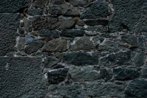 Texture of stone wall made of grey stones Stock Photos