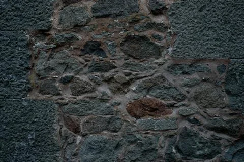 Texture of stone wall made of grey stones Stock Photos