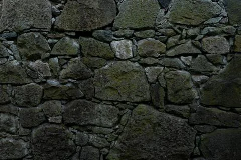 Texture of stone wall made of grey stones Stock Photos