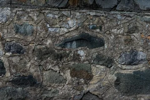 Texture of stone wall made of grey stones Stock Photos