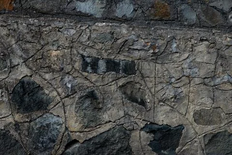 Texture of stone wall made of grey stones Stock Photos