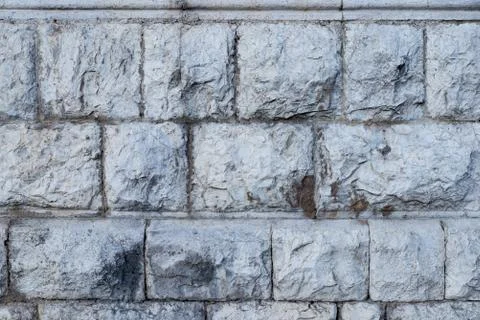 Texture of stone wall made of grey stones Stock Photos