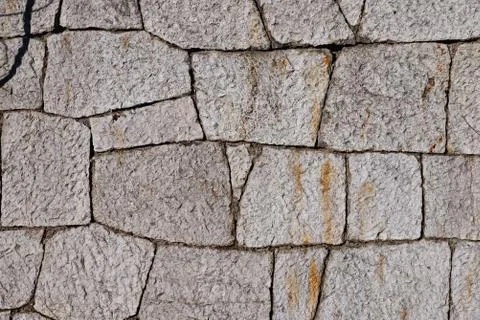 Texture of stone wall made of grey stones Stock Photos
