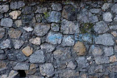 Texture of stone wall made of grey stones Stock Photos