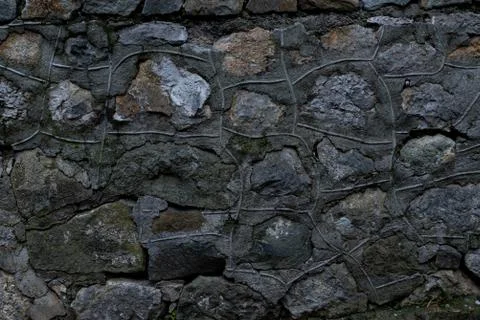 Texture of stone wall made of grey stones Stock Photos