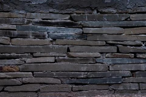 The texture of a stone wall made of rectangular strips Stock Photos