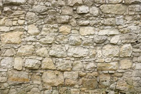 Texture of stone wall with many big brown stones Stock Photos