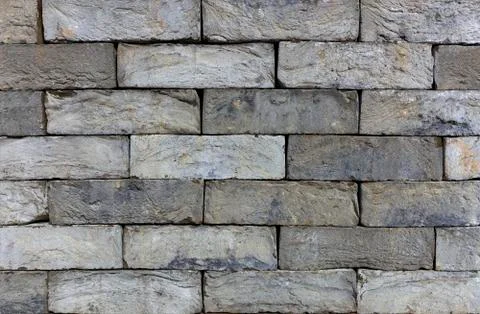The texture of the stone wall of the old brick. Italian building stone. Histo Stockfoto's