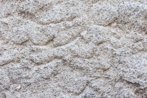 Texture of a stone wall of an old building, ancient architecture. Stock Photos