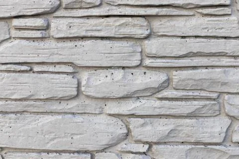 Texture of a stone wall. Old building gray textured background Stock Photos
