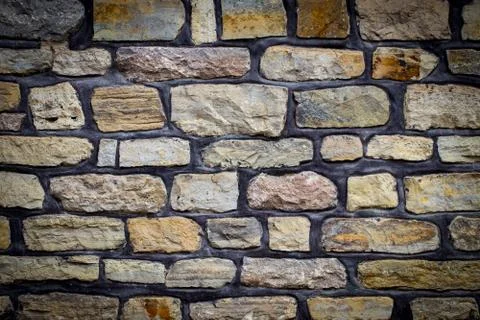 Texture of a stone wall. Old castle stone wall texture background. Stone wall Stock Photos