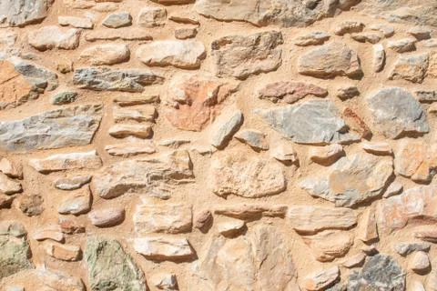 Texture of a stone wall. Old castle stone wall texture background. Briks ston Stock Photos