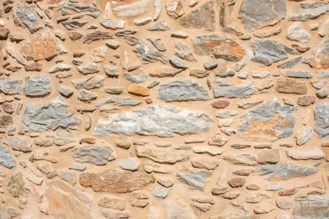 Texture of a stone wall. Old castle stone wall texture background. Briks ston Stock Photos