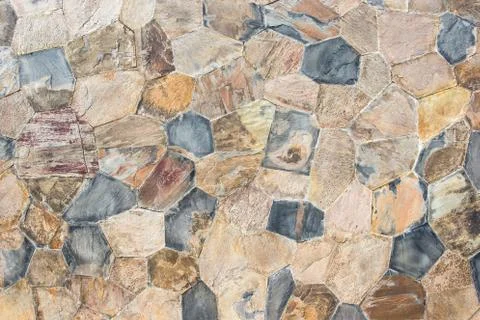 Texture of a stone wall. Old castle stone wall texture background. Stock Photos