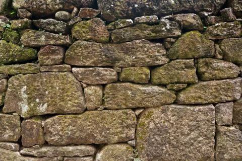 Texture of a stone wall. Old castle stone wall background. Wall made of wild  Stock Photos