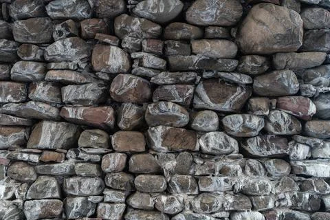 Texture of a stone wall. Old castle stone wall texture background. Stone wall as Stock Photos