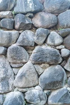 Texture of a stone wall. Old castle stone wall texture background. Stone wall as Stock Photos