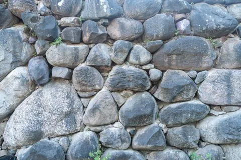 Texture of a stone wall. Old castle stone wall texture background. Stone wall as Stock Photos