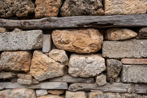 Texture of a stone wall. Old castle stone wall texture background. Stock Photos