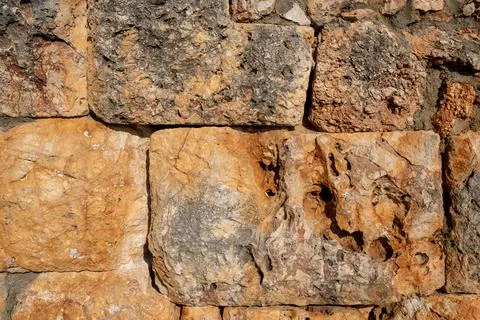 Texture of a stone wall. Old castle stone wall texture background. Stock Photos