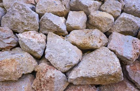 Texture of a stone wall. Old castle stone wall texture background. Brown, s.. Stock Photos