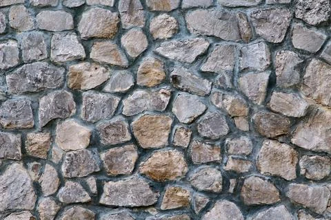 Texture of a stone wall. Part of old castle stone wall background. Gray stone Stock-Fotos