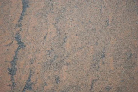 The texture of the stone wall, smooth brown stone texture with gray and black Stock Photos