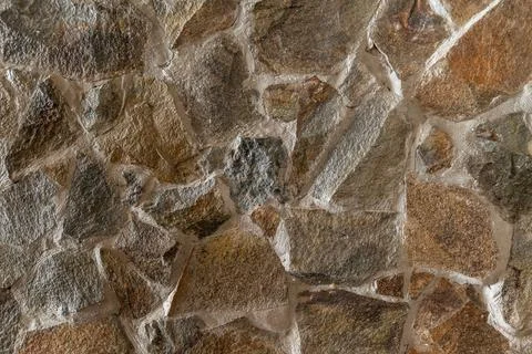 Texture of a stone wall. Stone wall as a background or texture. Stock Photos