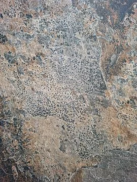 Texture of stone wall tiles in red and black colors creating a unique patte.. Stock-Fotos