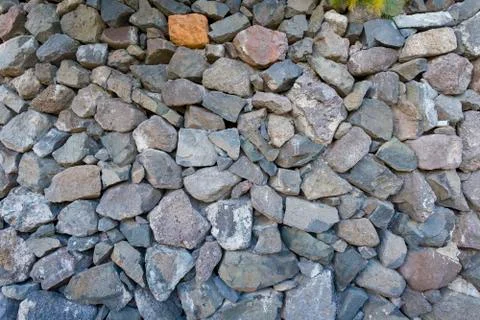 Texture of stones and cobblestones with sharp edges. Stock Photos
