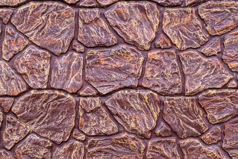 The texture of the stones covered with brown lacquer, can be used as a backgr Stock Photos