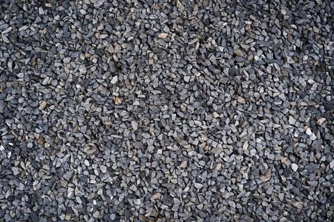 Texture of stones on the ground gray pebbles. Stock Photos