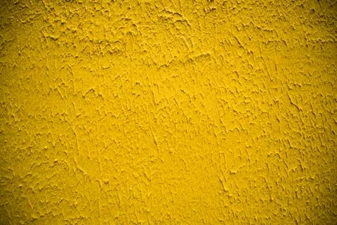 Texture structure of the wall, yellow color. Background. Postcrop. Stock Photos