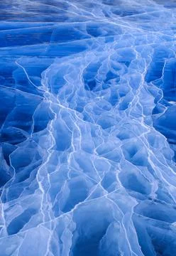 Texture of surface Baikal lake with cracks into ice. Stock Photos