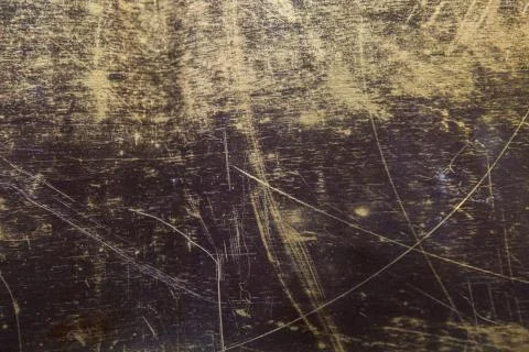 Texture of the surface of the brass leaf, in scratches, background Stock Photos