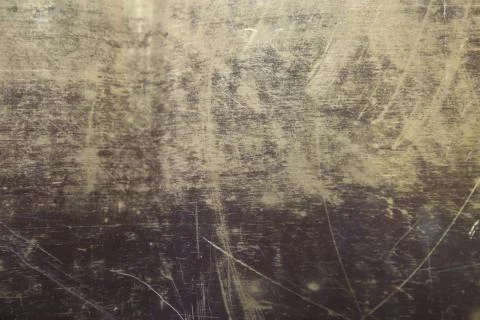Texture of the surface of the brass leaf, in scratches, background Foto stock