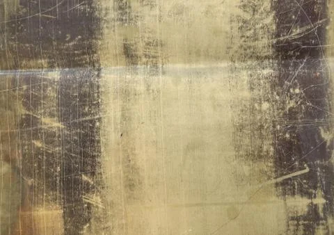 Texture of the surface of the brass leaf, in scratches, background Foto stock